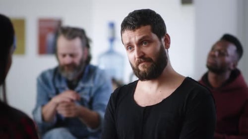 Man Shares Story at Group Therapy Session