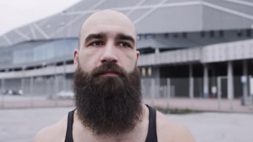 Handsome Guy With Beard Walks Down The Street.