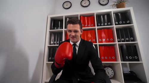 Angry Aggressive Businessman with Boxing Gloves
