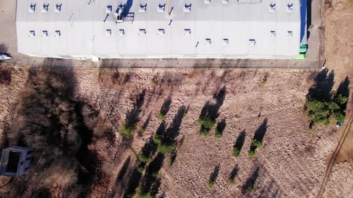 Industrial factory with roof ventilators, small business, landscape
