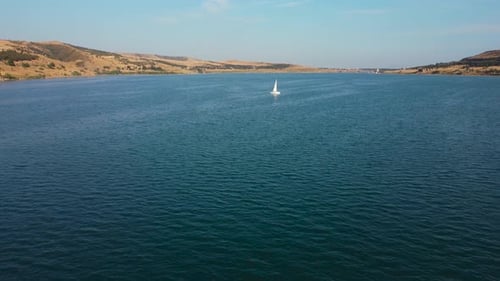 Floating Sailing Boat In The Lake