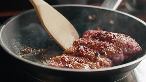 Chef Frying Ribs Closeup
