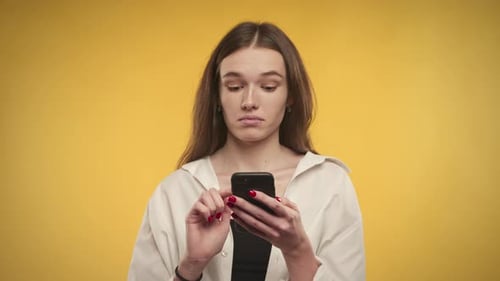 Woman Reading Smartphone with Displeased Expressions