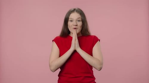 Teen Showing Emotions Against a Pink Background