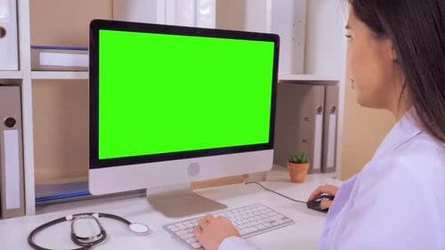 Nurse Works with Medical Records