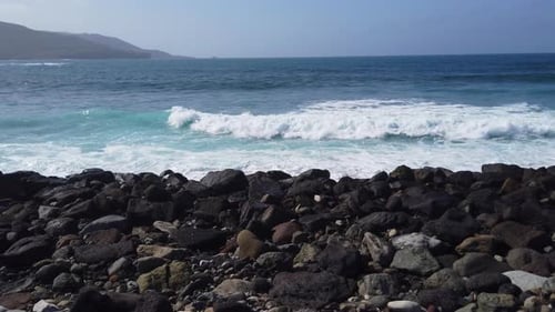 Gran Canaria Beach with Waves Crashing Through Rocks