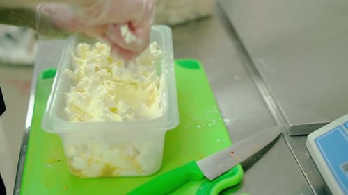 Preparing Cheese in Commercial Kitchen, Close Up