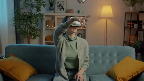 Woman Using VR Headset at Home