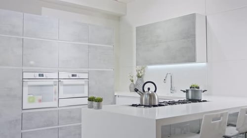 Tracking shot of a luxury kitchen with gray modern design