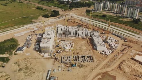 Aerial View of a Construction Site with Cranes