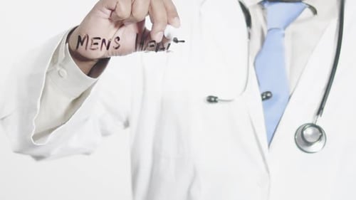 Doctor Writes Mens Health on Clear Surface