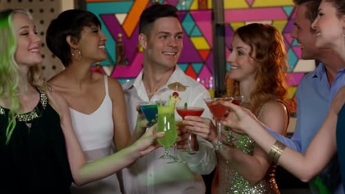 Cheerful Friends Toasting at a Festive Nightclub