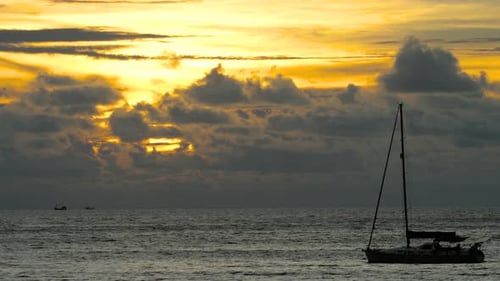 Yacht in the Tropical Sea at Dramatic Sunset
