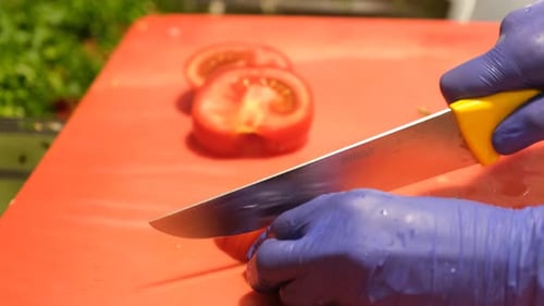 Chopping Tomatoes on Table