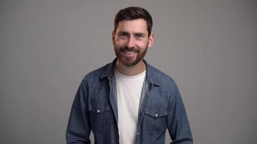 Man Smiling in Amazement at the Camera