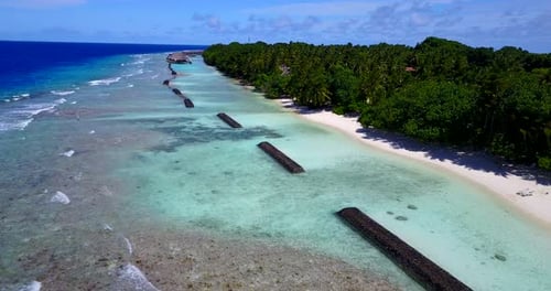 Tropical aerial abstract shot of a sunshine white sandy paradise beach and blue water background in