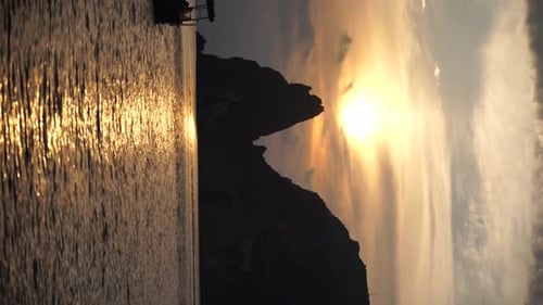 Sea Landscape with Rocky Coastline on Sunset Time