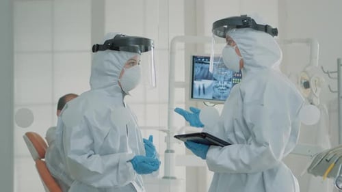 Medical Staff Consulting in Dentist Office in PPE