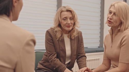 Women Supporting Each Other in Therapy Session