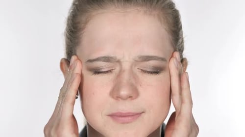 Close Up of Casual Young Woman Face Gesturing Headache Stress