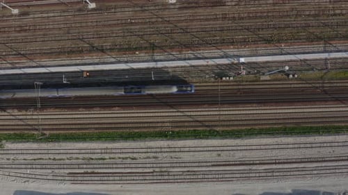 Aerial view. Modern high speed train. Railroad in landscape, aerial view from above.