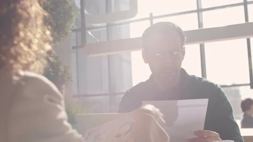 Business Discussion in Bright Modern Office Space