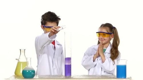 Excited Children Perform Science Experiment with Foam Eruption
