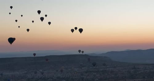 Aerial Cinematic Drone View of Colorful Hot Air Balloon Flying Over Cappadocia