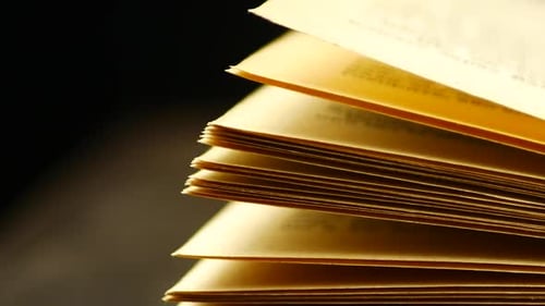Old books on a wooden shelf