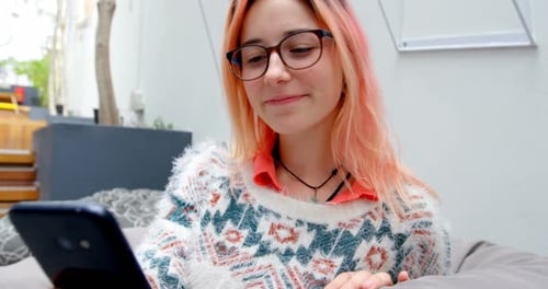 Female executive using mobile phone in office 4k