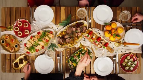 Friends Celebrating New Year Top View Sitting at Dining Table