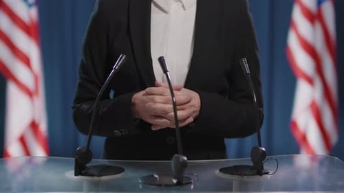 Professional Speaker at Podium with USA Flags