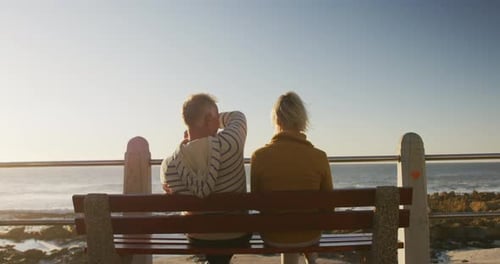 Senior couple embracing each other at beach