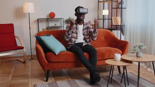 Man Experiencing Virtual Reality with VR Headset at Home