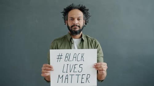 Man Holds Black Lives Matter Sign