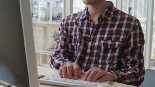 Young man working in a creative office