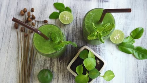 Healthy Green Spinach Smoothie On Wooden Table