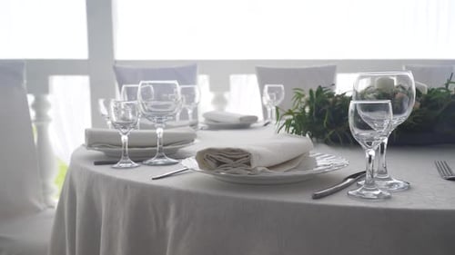 Elegant Wedding Table Setting with Floral Arrangement