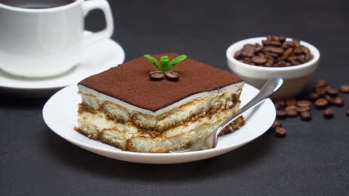 Delicious Tiramisu Cake and Coffee on Table