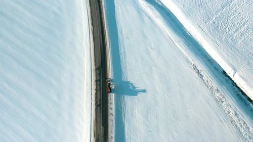Aerial View Snow Removal Tractor Clears Road From Snow