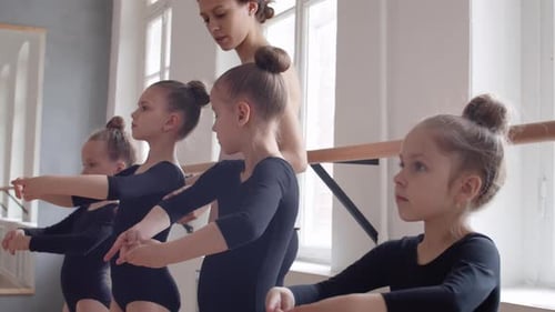 Young Children Taking Ballet Lesson with Teacher