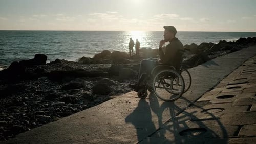Thoughtful Disabled Man Near the Sea