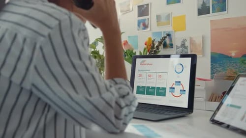 Young Adult Working With Technology in Office