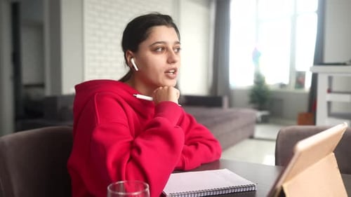 Beautiful Caucasian Female Student is Studying in College Remotely