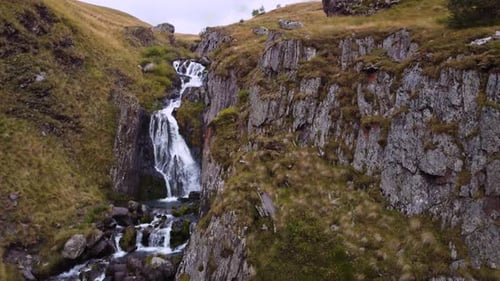 Waterfalls Cascade In The Rocky Mountain Valley