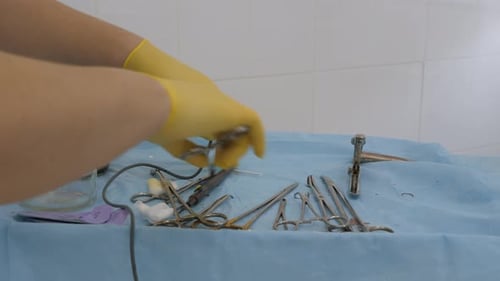 Hands Prepare Surgical Tools in Sterile Hospital Environment