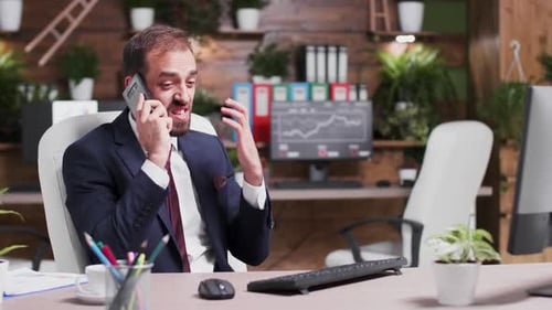 Businessman Arguing on the Phone in Office