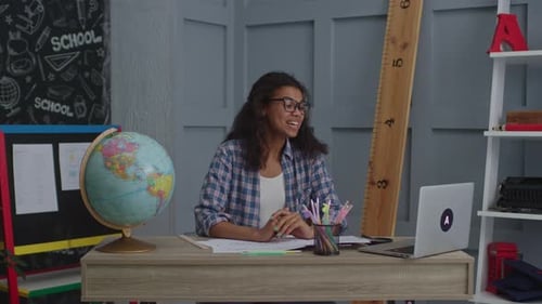 Smiling Woman Teaching Online From Home Classroom