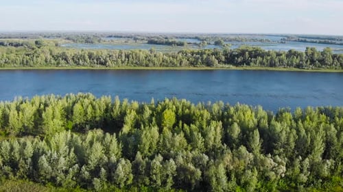 Aerial Shot. Summer Landscape with River and Blue Sky. Beautiful Spills in the River Valley