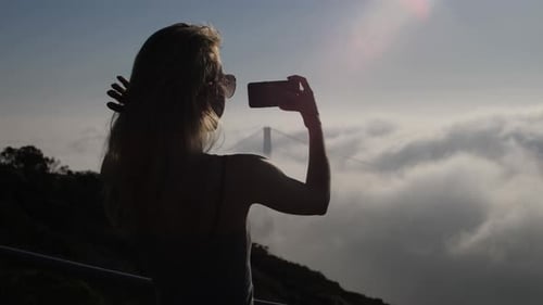 Woman Photographs Golden Gate Bridge in San Francisco
